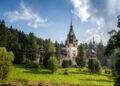 Amazing panoramic picture of the beautiful Peles Castle and its beautiful gardens near Sinaia, Romania